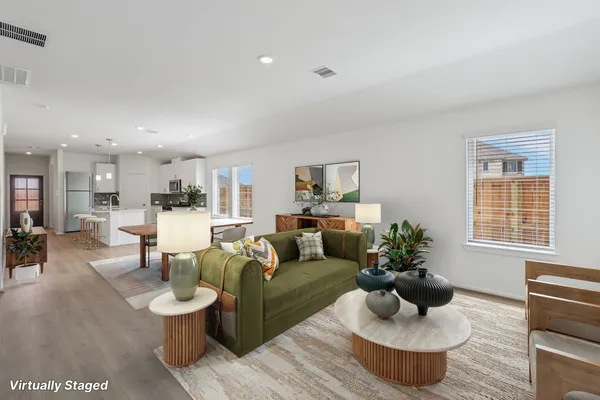 a living room with furniture and a table