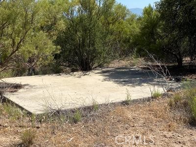 19 Higgins Road Anza, CA 92539 - Photo 5 of 18 a view of a yard covered with snow in the yard