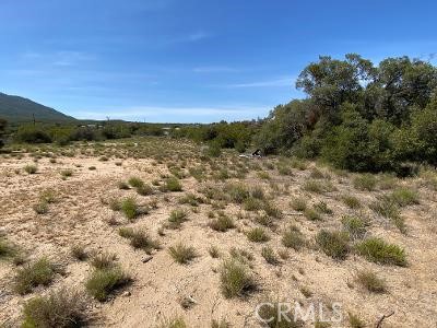 19 Higgins Road Anza, CA 92539 - Photo 8 of 18 a view of a large building with a mountain in the background