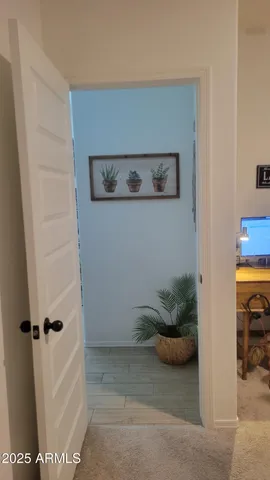 a bedroom with furniture and a lamp