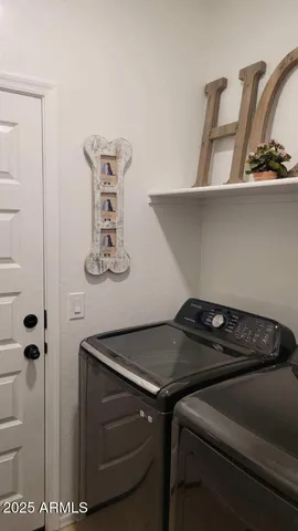 a sitting area with furniture and wooden floor