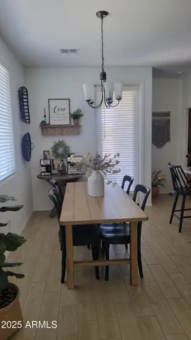 a kitchen with a stove a sink cabinets and dining table