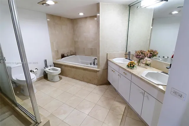 a bathroom with a bathtub sink and toilet