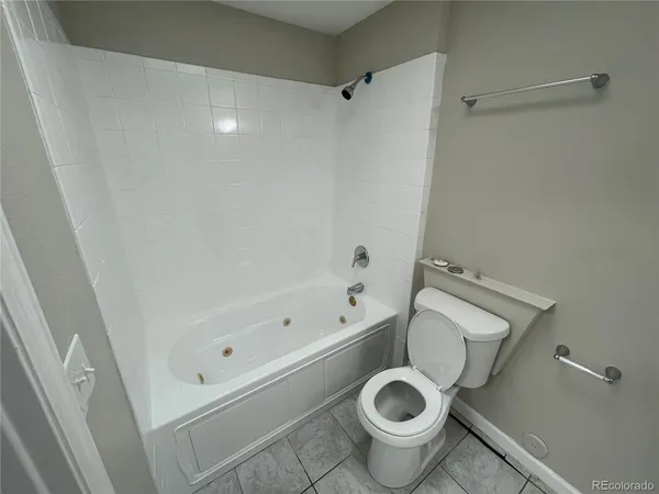a bathroom with a sink a toilet and bathtub