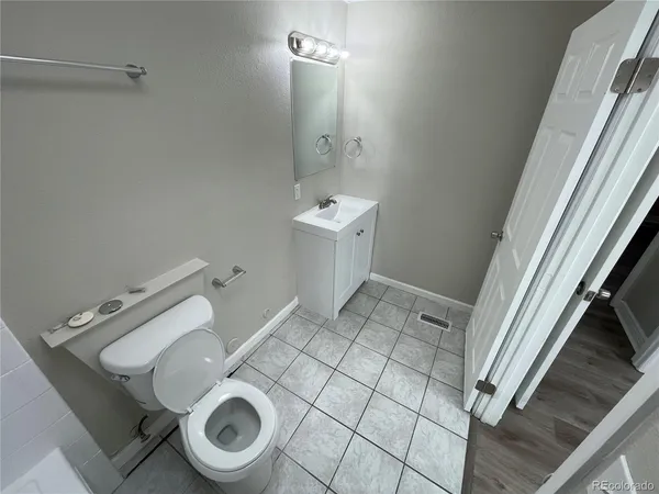 a bathroom with a sink and toilet