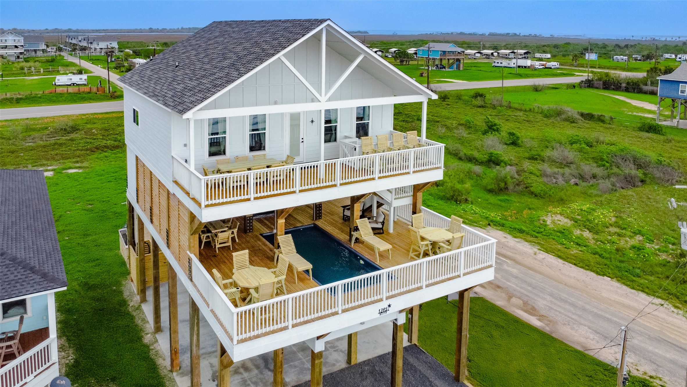 aerial view of a house with a yard