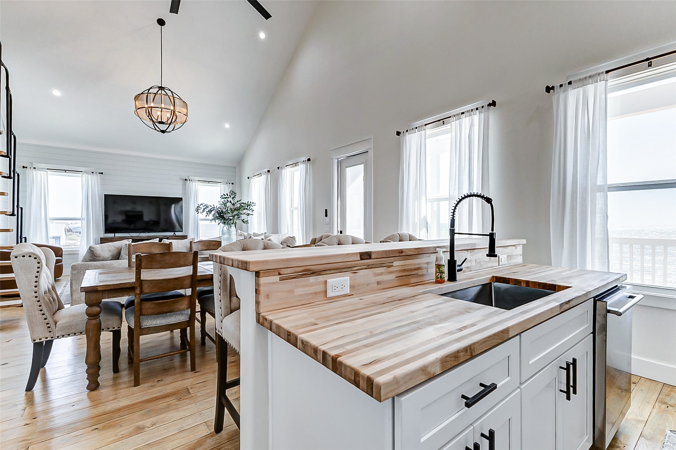 1395 Keith Avenue Port Bolivar, TX 77617 - Photo 18 of 38 a kitchen with a table chairs sink and cabinets