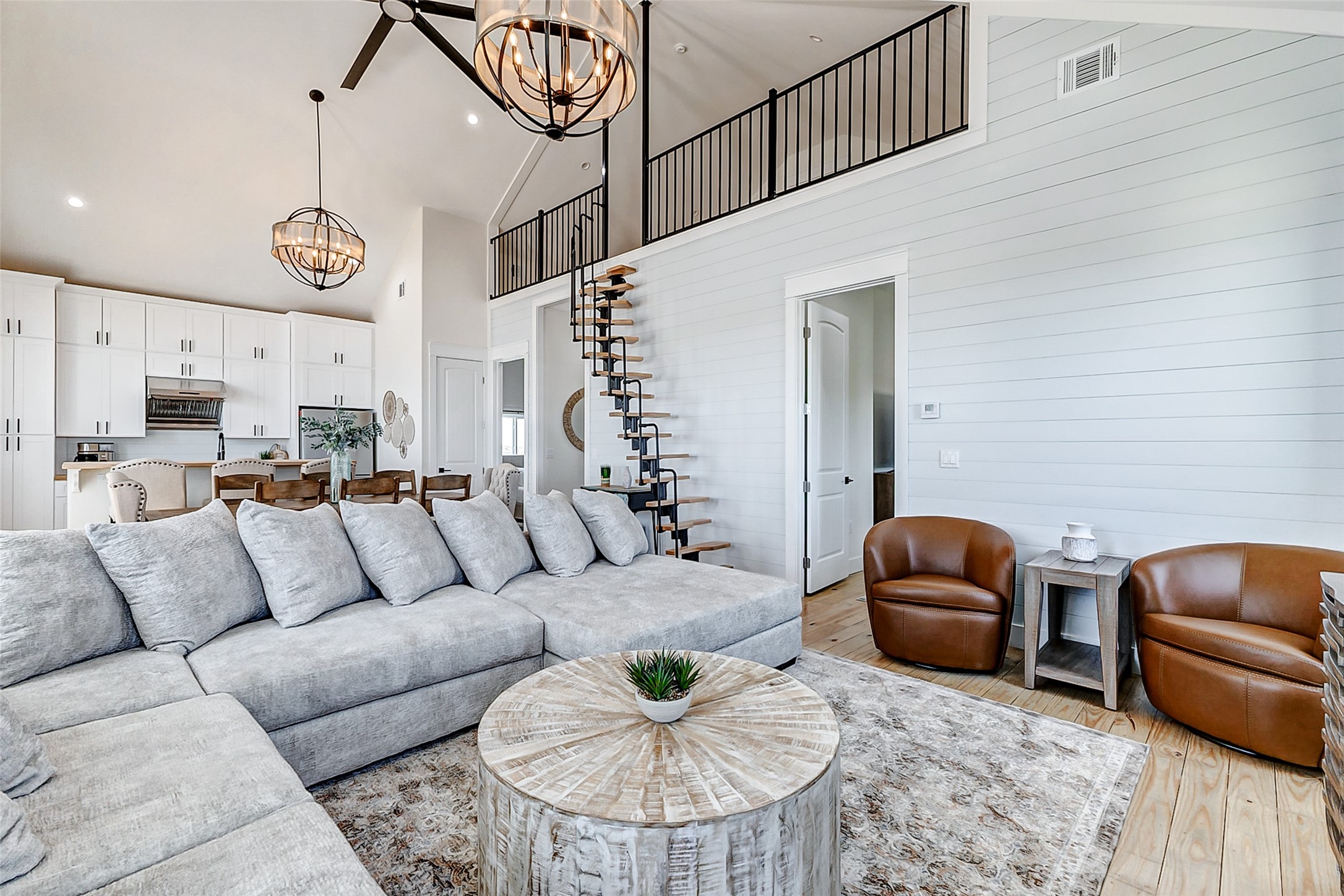 1395 Keith Avenue Port Bolivar, TX 77617 - Photo 21 of 38 a living room with furniture kitchen view and a chandelier