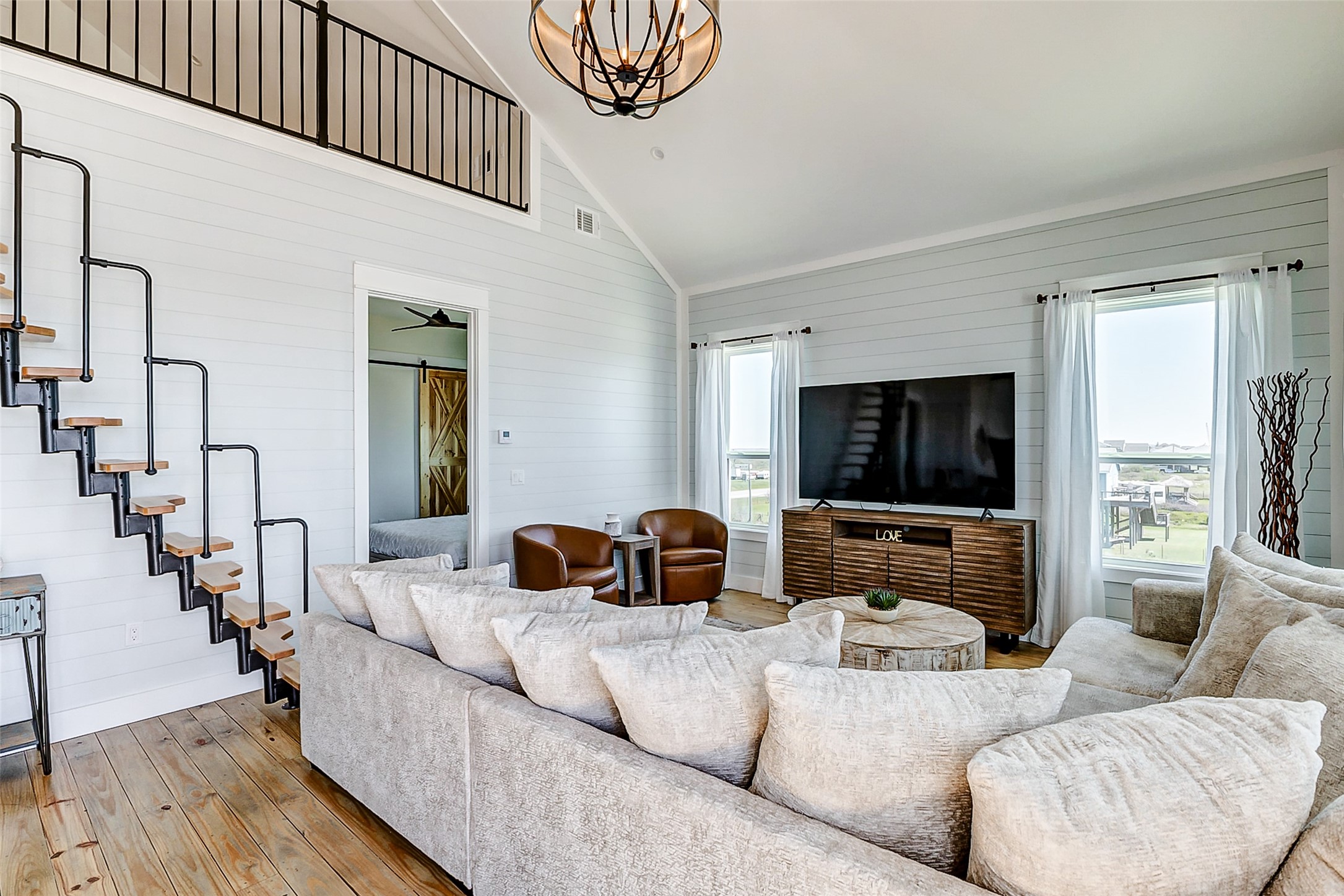 1395 Keith Avenue Port Bolivar, TX 77617 - Photo 22 of 38 a living room with fireplace furniture and a flat screen tv