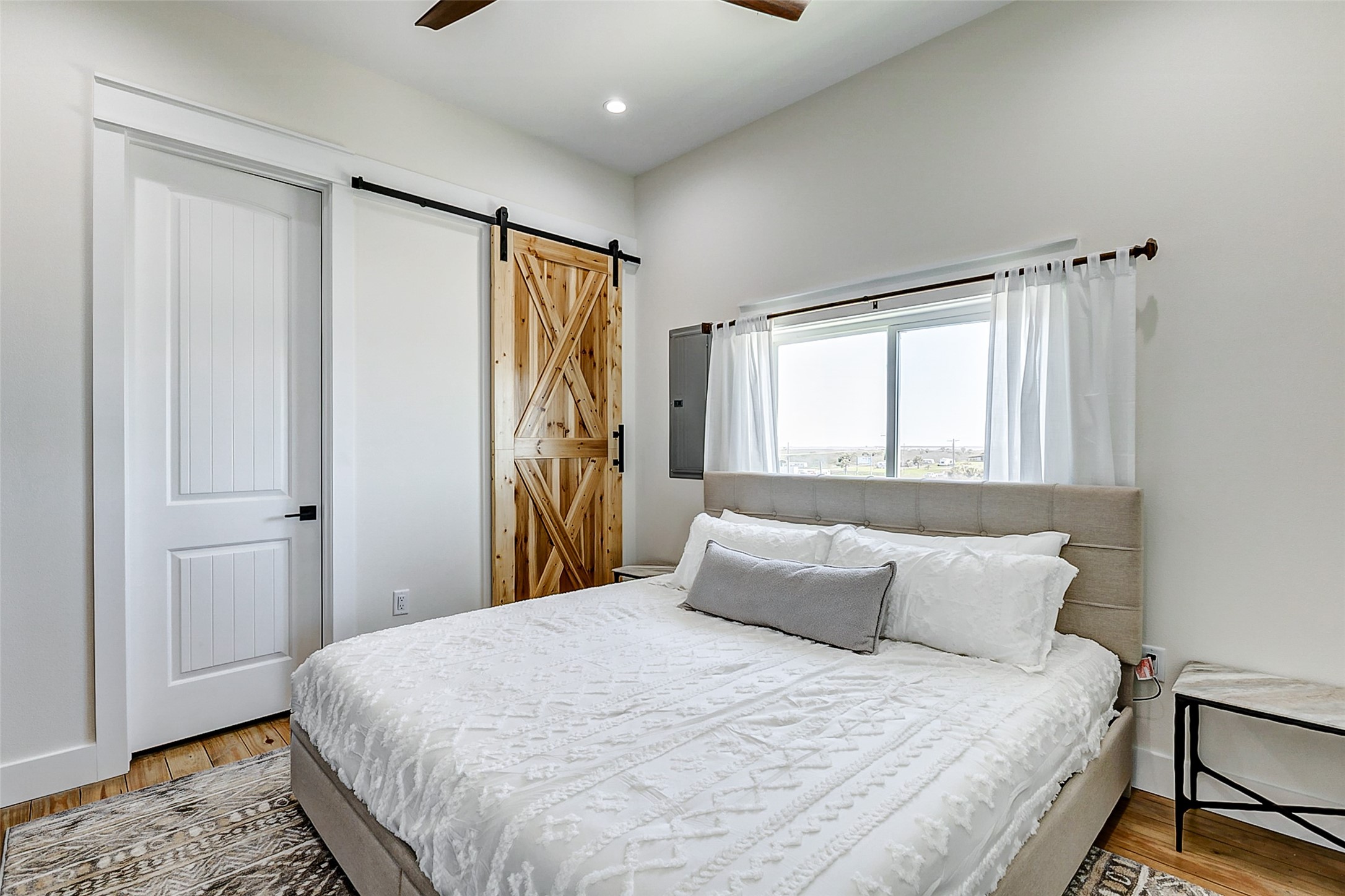 1395 Keith Avenue Port Bolivar, TX 77617 - Photo 23 of 38 a bedroom with a bed and a window