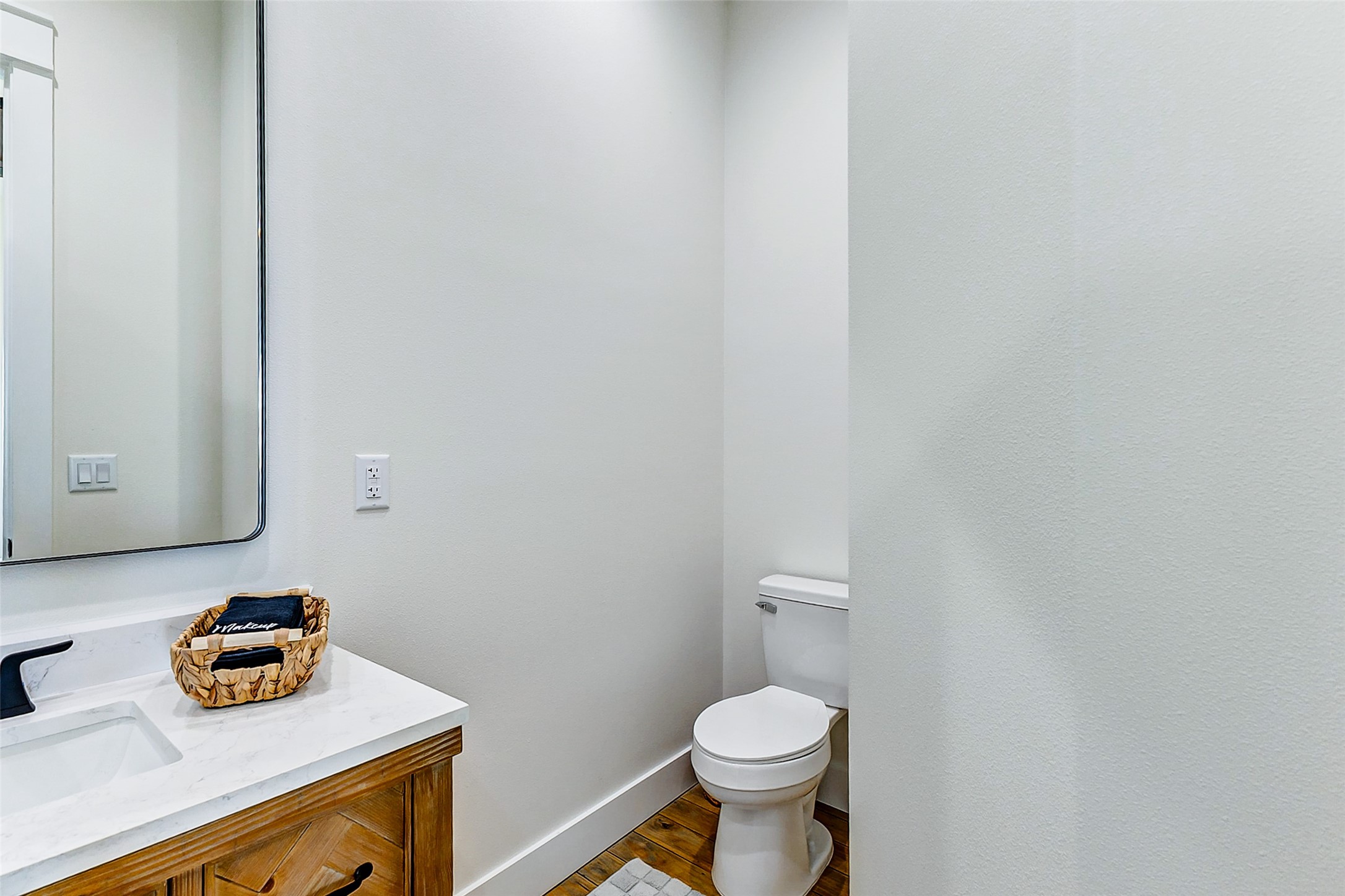 1395 Keith Avenue Port Bolivar, TX 77617 - Photo 26 of 38 a bathroom with a sink a toilet and a vanity