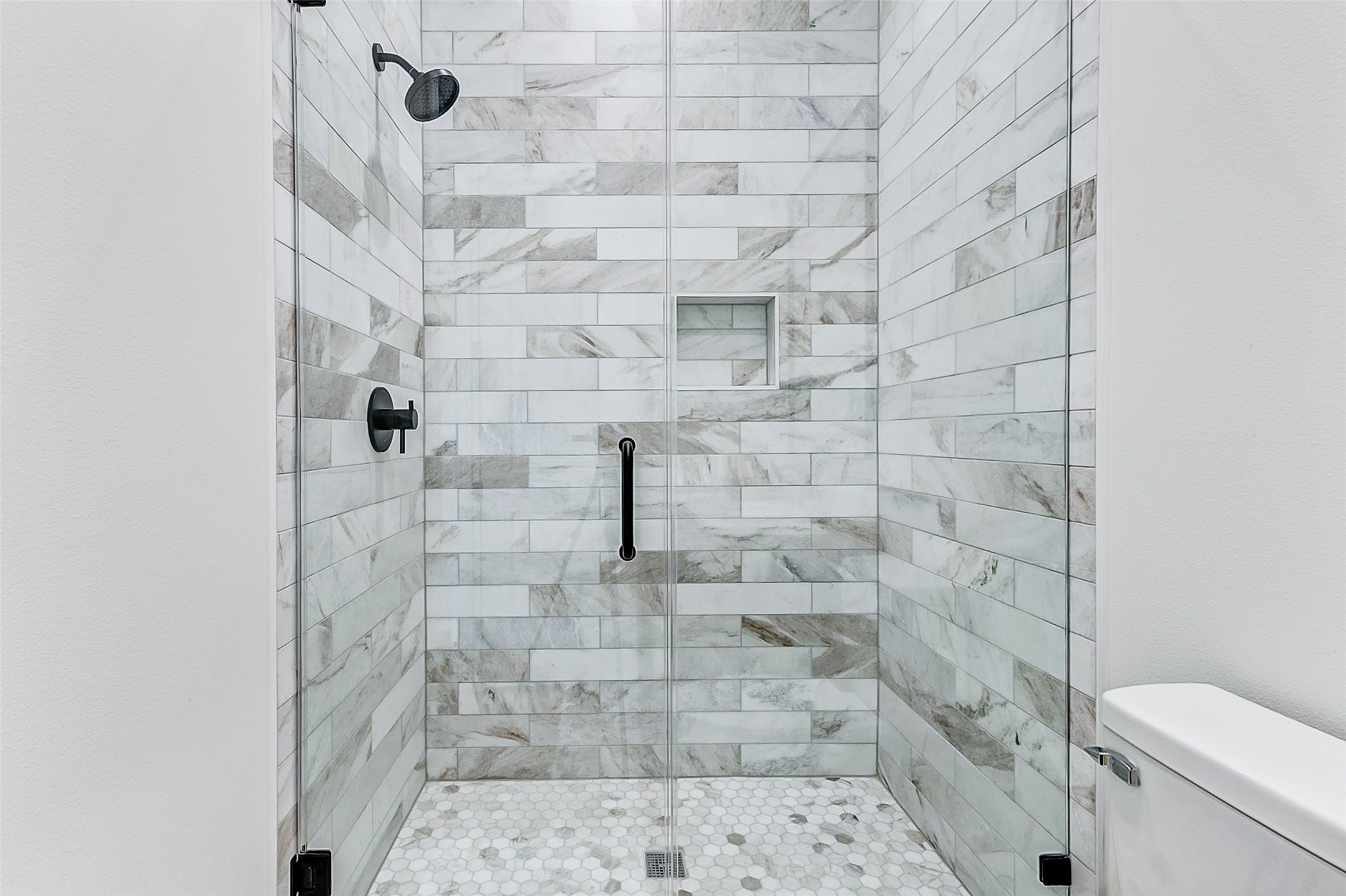 1395 Keith Avenue Port Bolivar, TX 77617 - Photo 30 of 38 a bathroom with a toilet and a shower