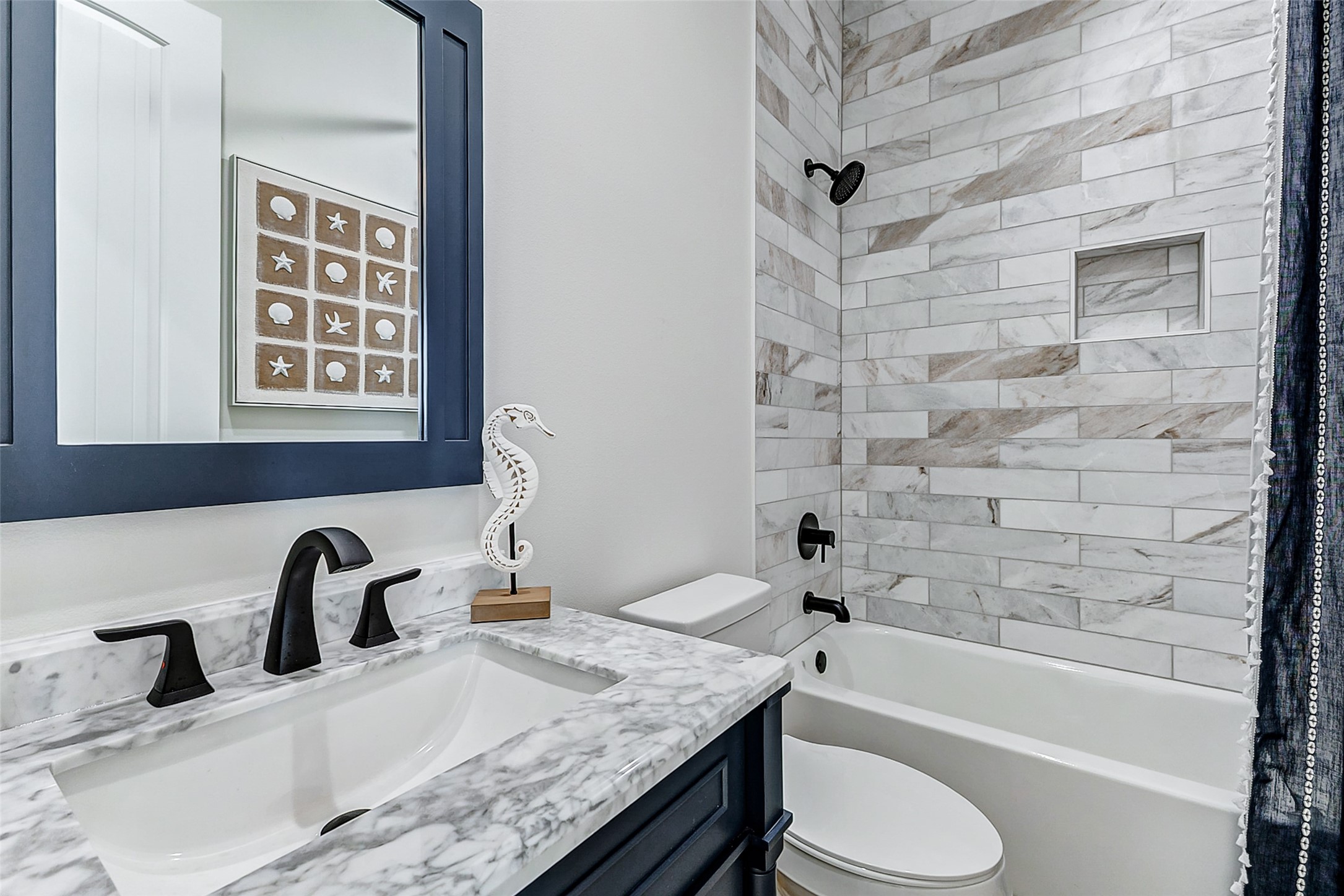 1395 Keith Avenue Port Bolivar, TX 77617 - Photo 31 of 38 a bathroom with a granite countertop sink toilet and bathtub