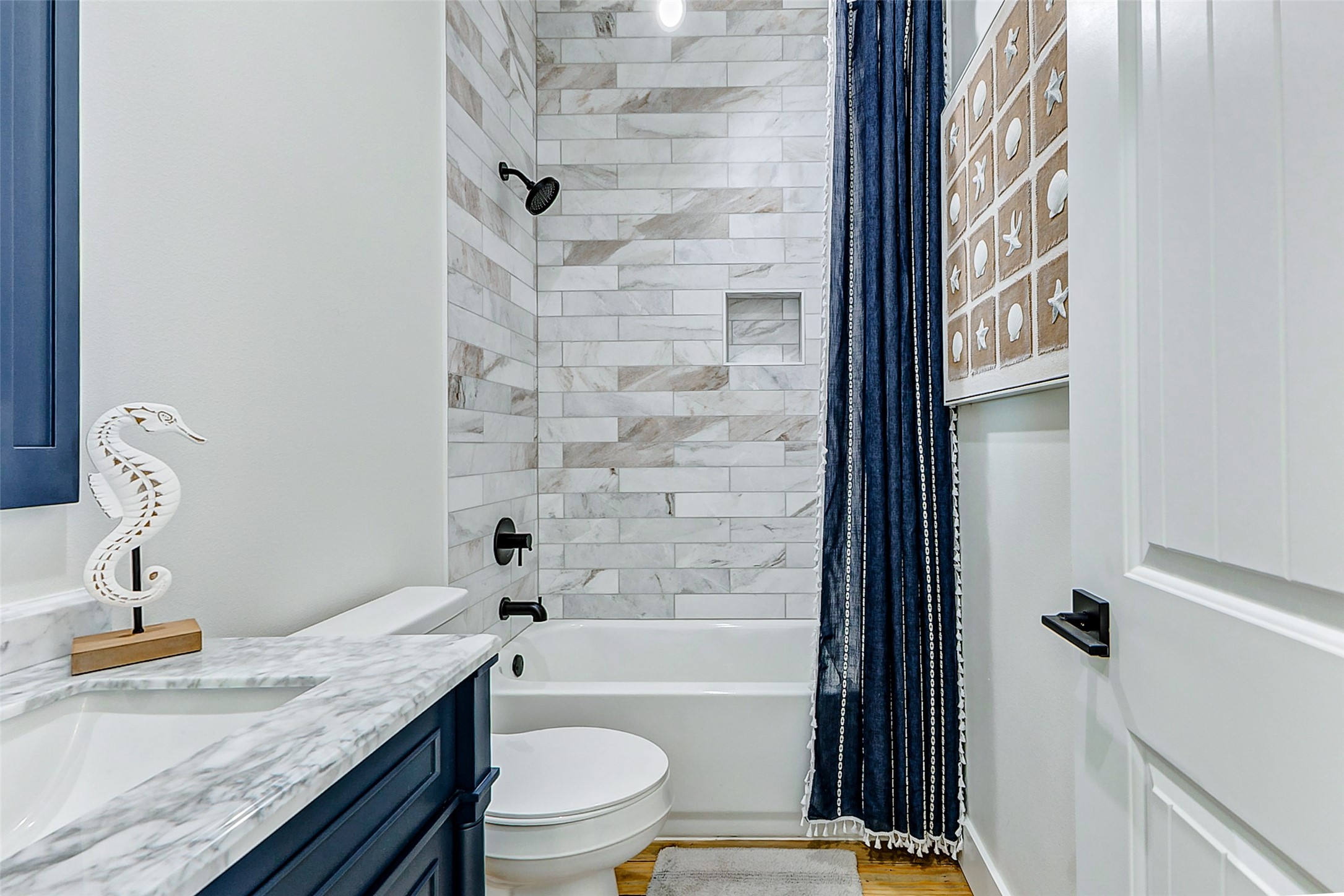 1395 Keith Avenue Port Bolivar, TX 77617 - Photo 32 of 38 a bathroom with a granite countertop sink toilet and shower