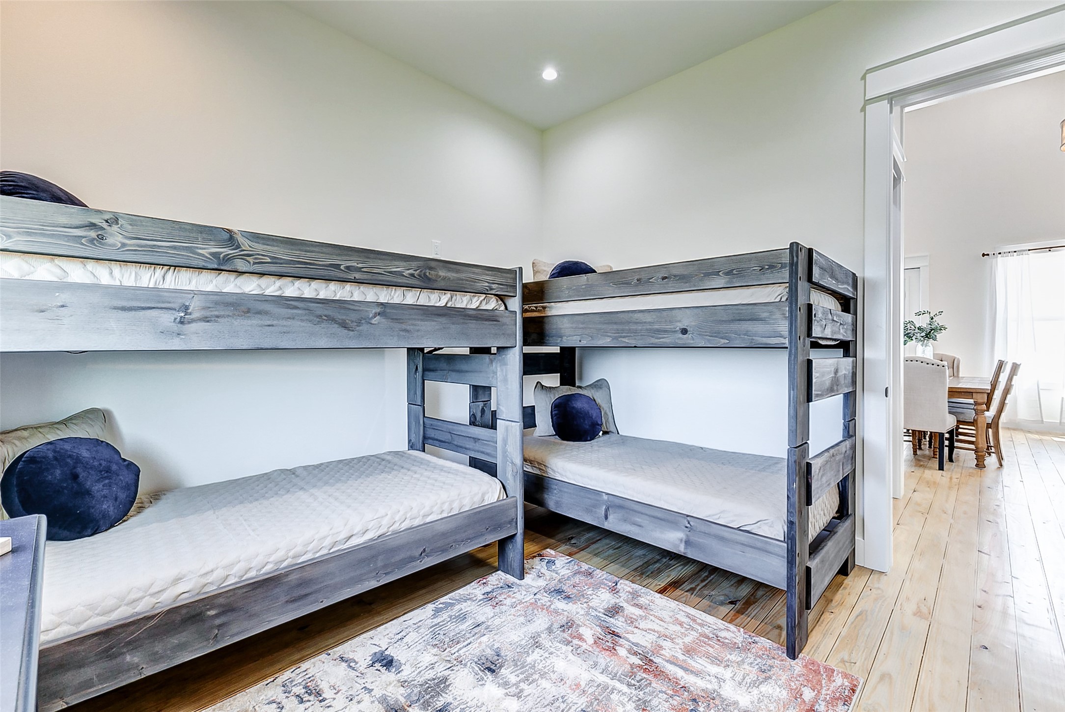 1395 Keith Avenue Port Bolivar, TX 77617 - Photo 33 of 38 a bedroom with two beds and painted walls