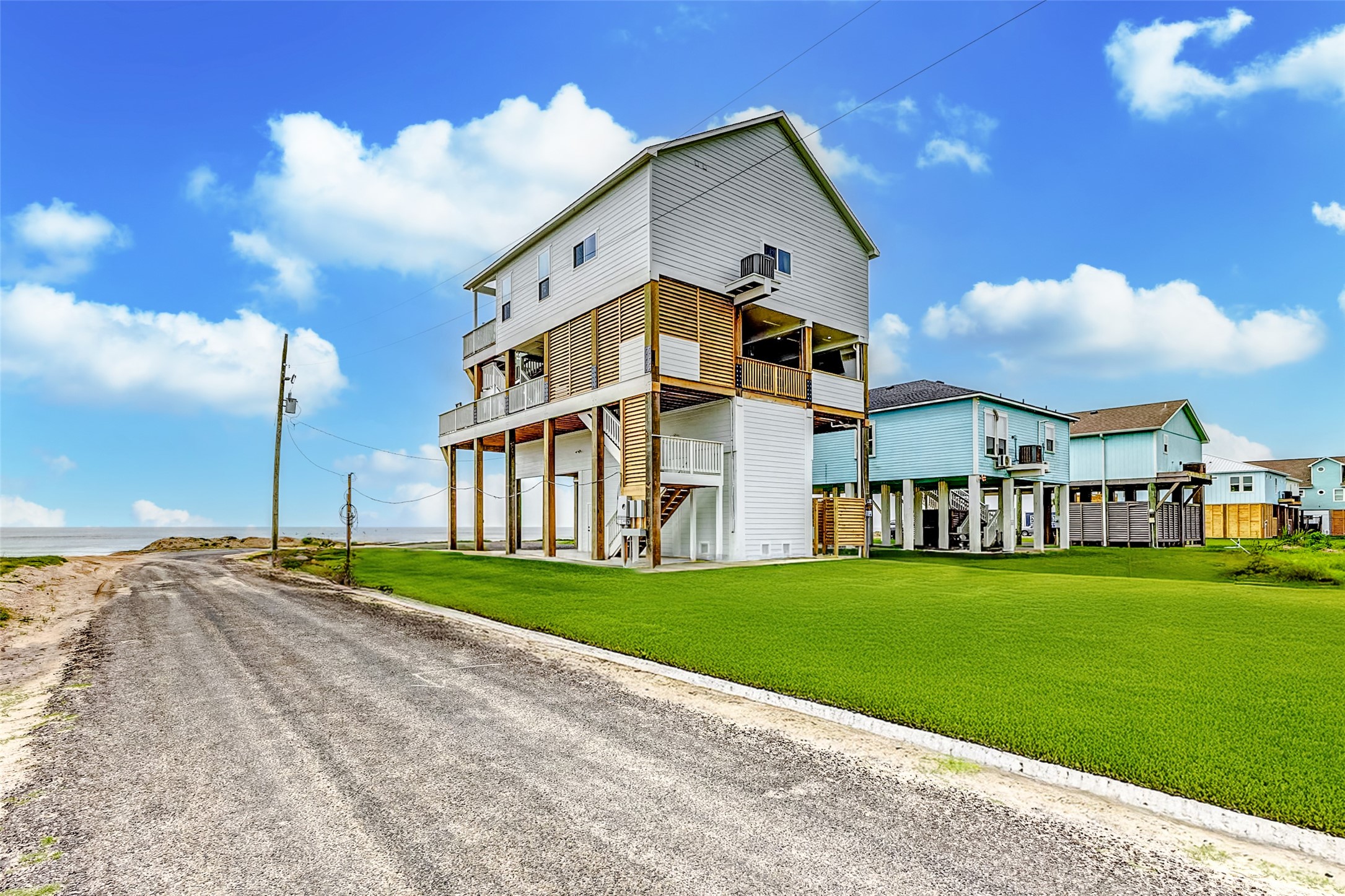 1395 Keith Avenue Port Bolivar, TX 77617 - Photo 8 of 38 a front view of a house with a yard