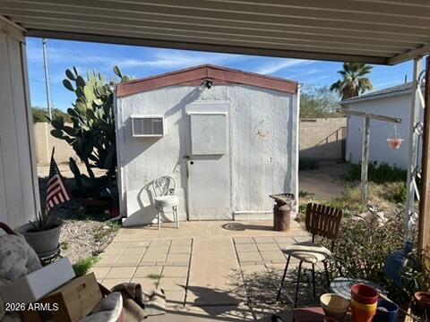 501 Arnold Way Coolidge, AZ 85128 - Photo 15 of 15 a view of a patio with table and chairs potted plants