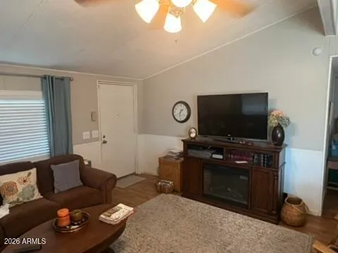 a living room with furniture and a flat screen tv