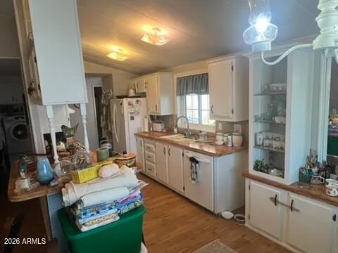 a kitchen with stainless steel appliances granite countertop a stove refrigerator and cabinets