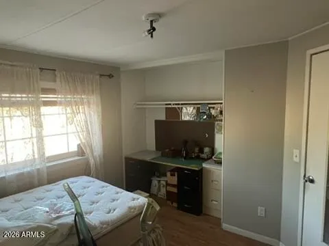 a bedroom with a bed and a window