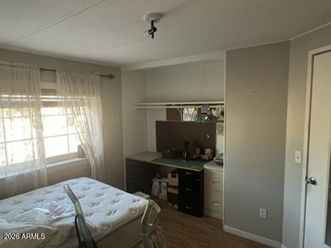 501 Arnold Way Coolidge, AZ 85128 - Photo 9 of 15 a bedroom with a bed and a window