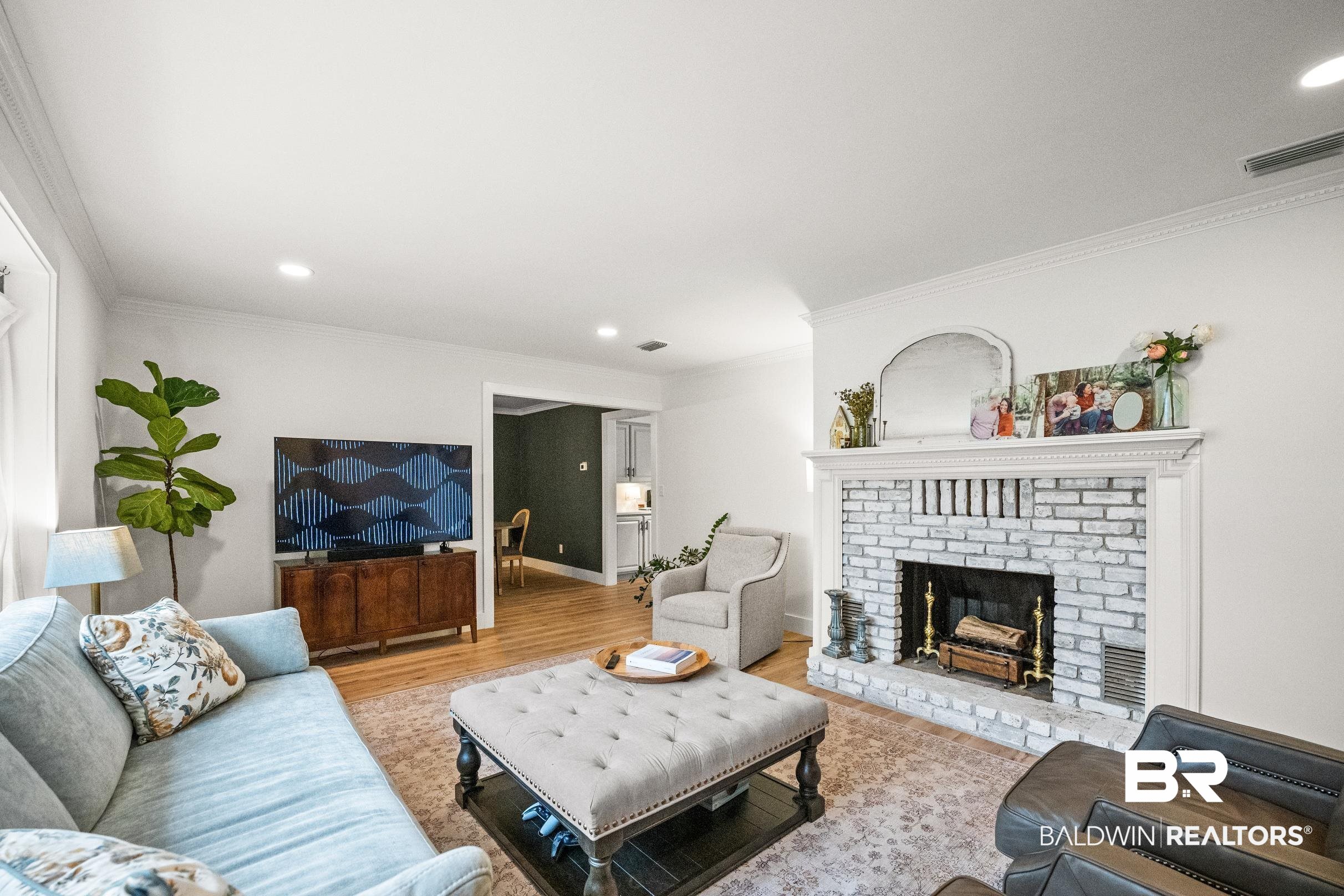 6 Wren Circle Foley, AL 36535 - Photo 13 of 55 Living room featuring visible vents, recessed lighting, ornamental molding, a brick fireplace, and light wood-type flooring