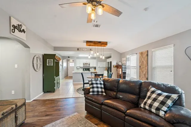 a living room with furniture and a large window