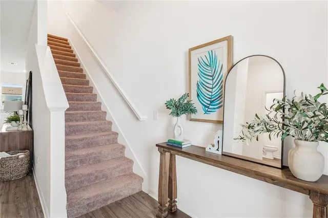 a view of entryway with paintings on the wall