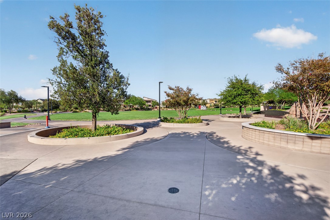 1100 East Sunset Road Henderson, NV 89011 - Photo 54 of 58 Ample green spaces and mature landscaping create a serene community park setting.