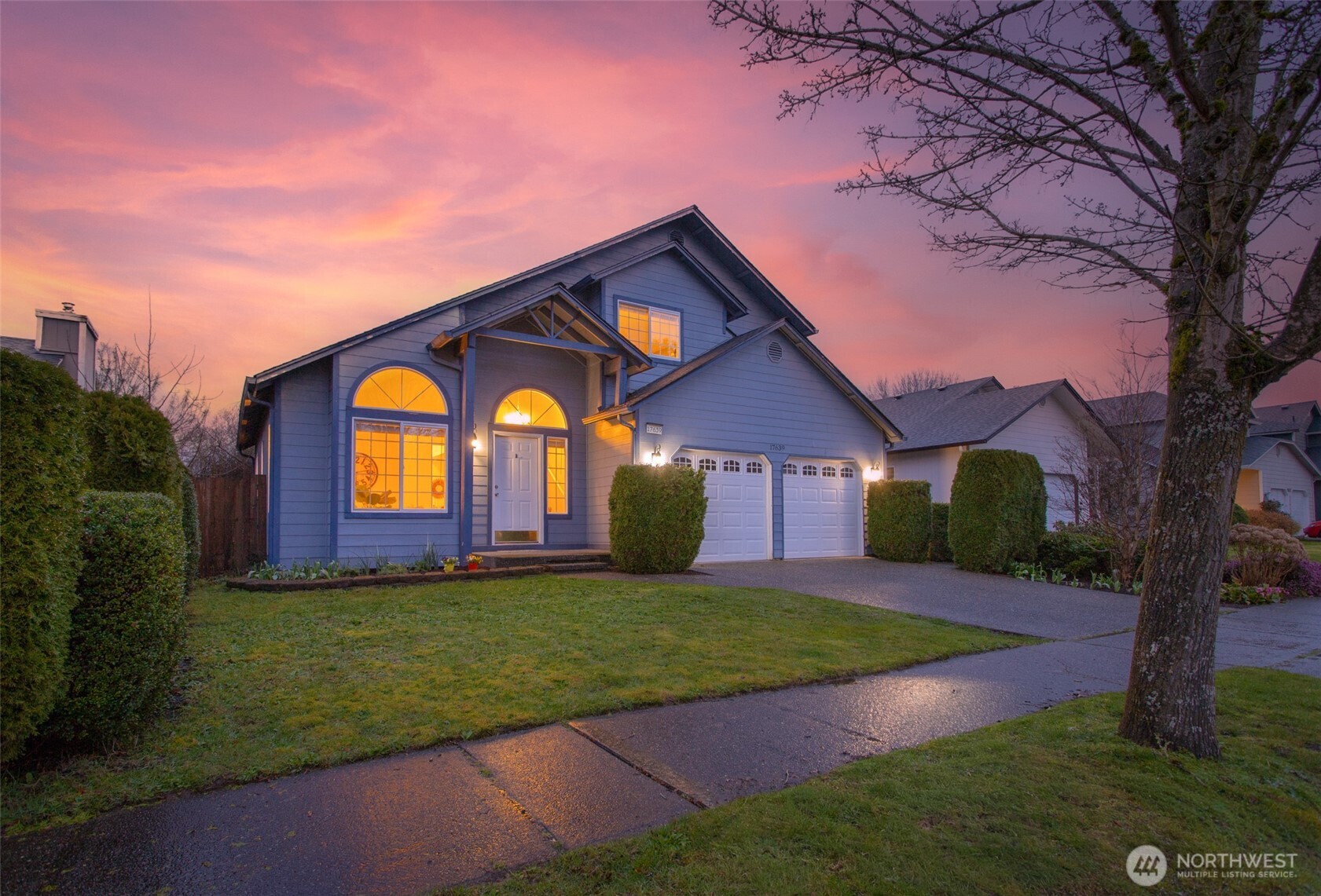 17639 Stanton Street Southeast Monroe, WA 98272 - Photo 1 of 24 a view of a yard with a house in the background