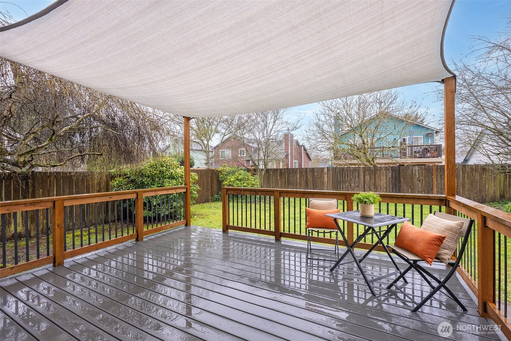 17639 Stanton Street Southeast Monroe, WA 98272 - Photo 14 of 24 a view of a chairs and table on the wooden deck