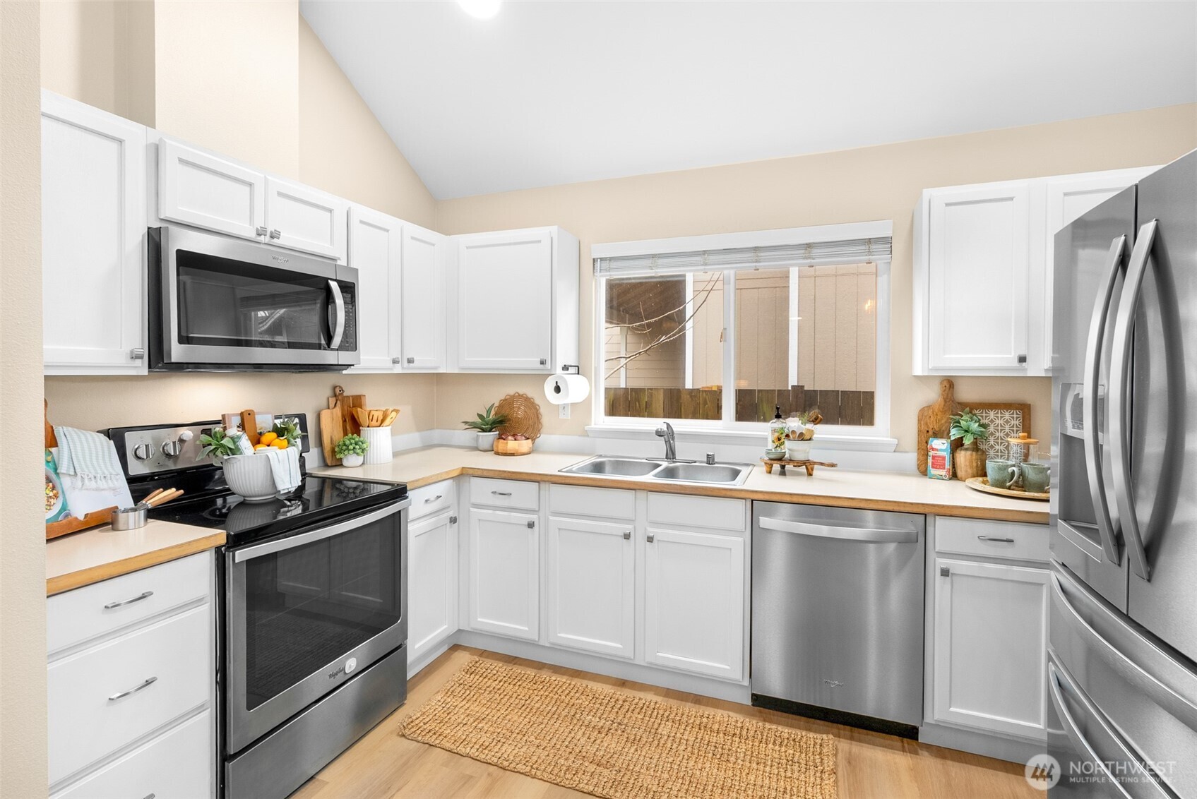 17639 Stanton Street Southeast Monroe, WA 98272 - Photo 5 of 24 a kitchen with a sink stove top oven and refrigerator
