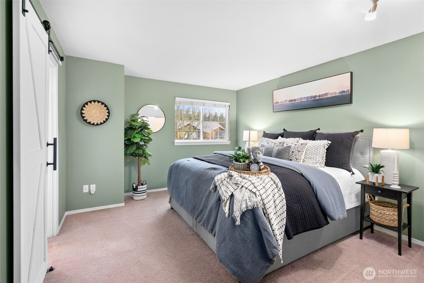 17639 Stanton Street Southeast Monroe, WA 98272 - Photo 9 of 24 a bedroom with a bed and a chandelier