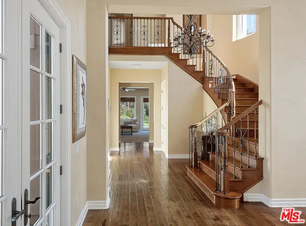 a view of entryway with wooden floor