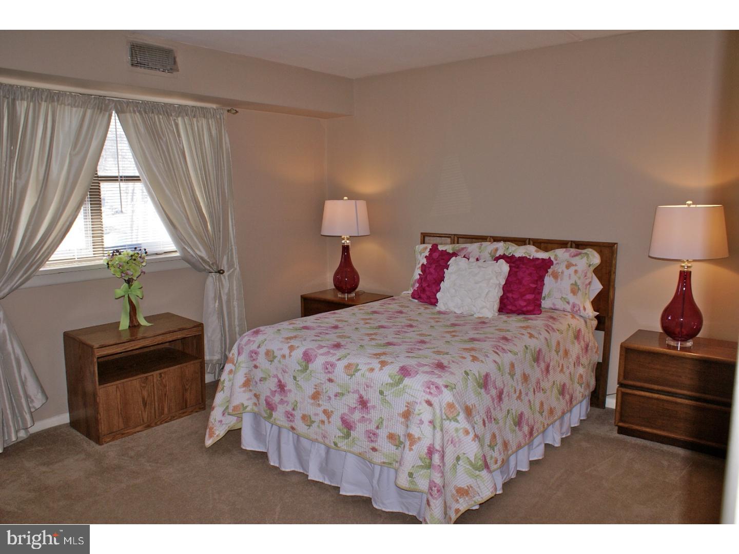 64 Welsh Tract Road, Unit 301 Newark, DE 19713 - Photo 12 of 15 a bedroom with a bed and window