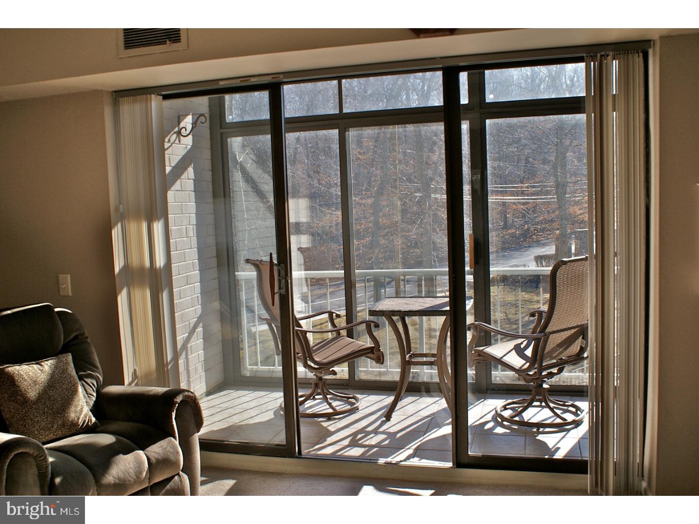 64 Welsh Tract Road, Unit 301 Newark, DE 19713 - Photo 5 of 15 a view of a living room and dining room with furniture