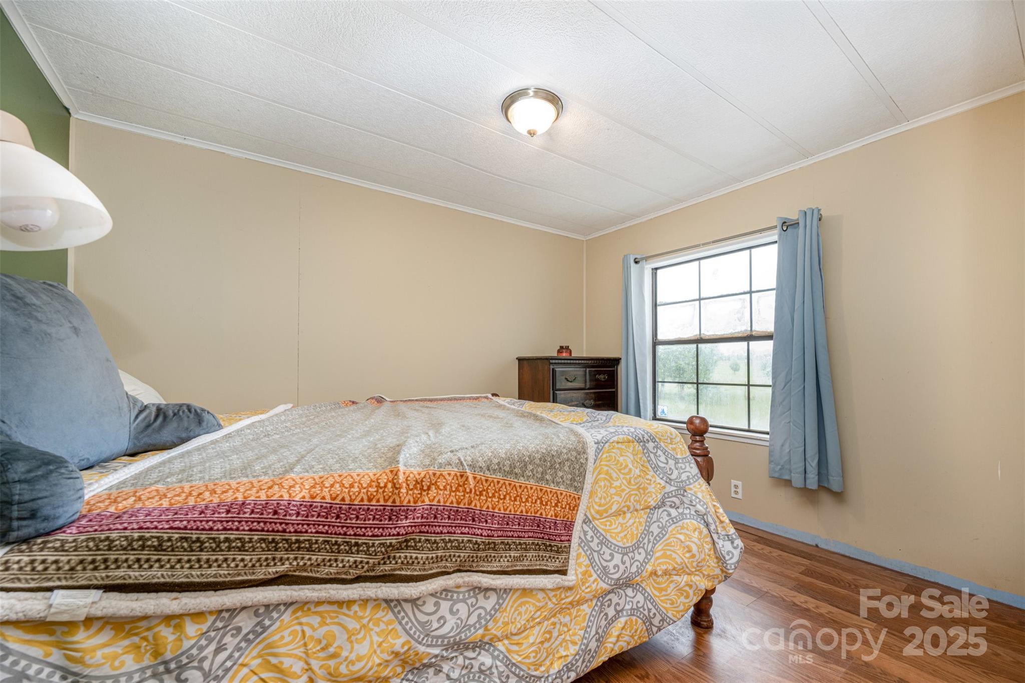 316 Josey Road Statesville, NC 28625 - Photo 11 of 27 a bed sitting in a bedroom next to a window
