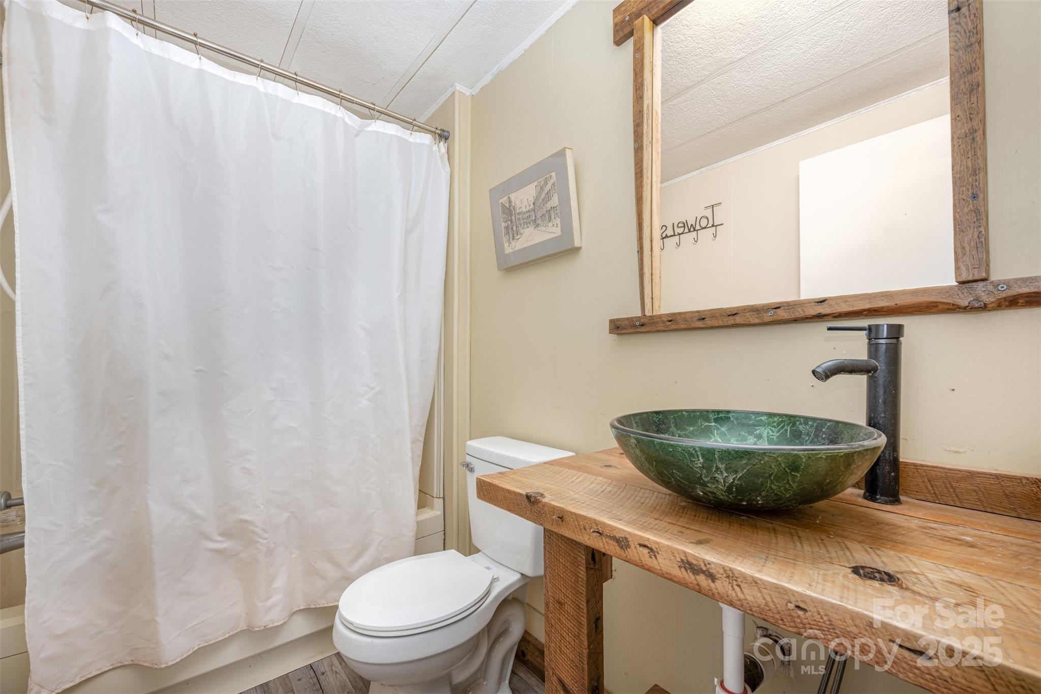 316 Josey Road Statesville, NC 28625 - Photo 12 of 27 a living room with a table and a chair