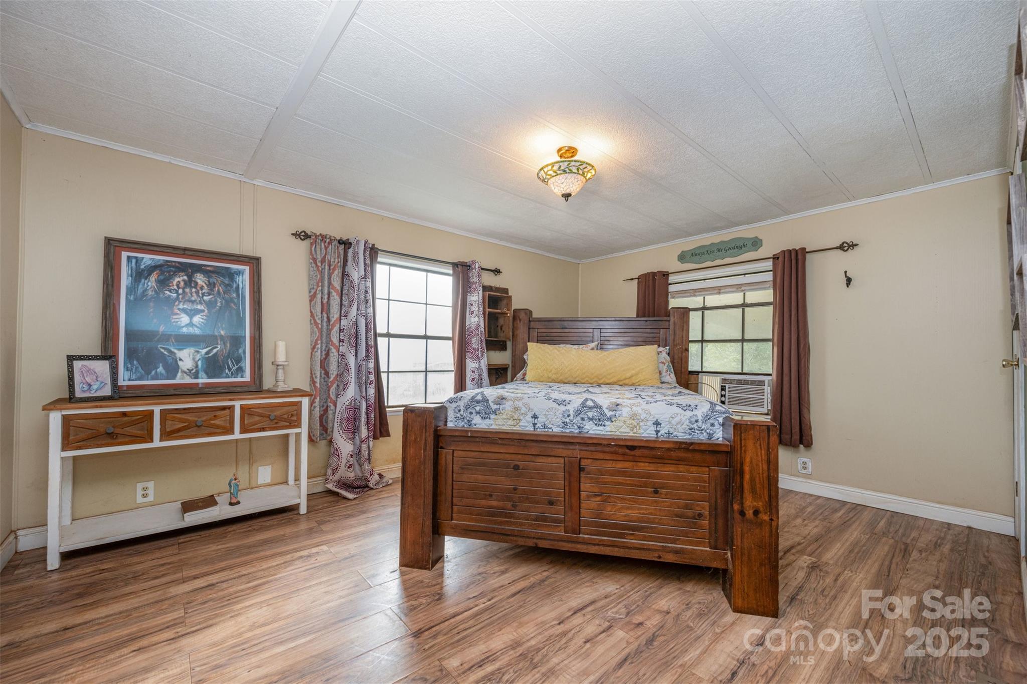 316 Josey Road Statesville, NC 28625 - Photo 13 of 27 a bedroom with a bed and a dresser in it