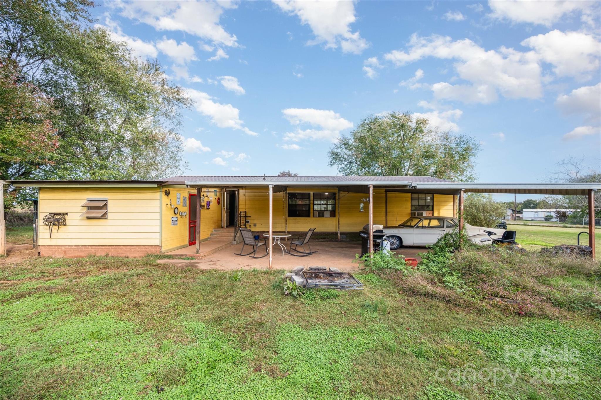 316 Josey Road Statesville, NC 28625 - Photo 17 of 27 a view of a house with backyard sitting area and garden