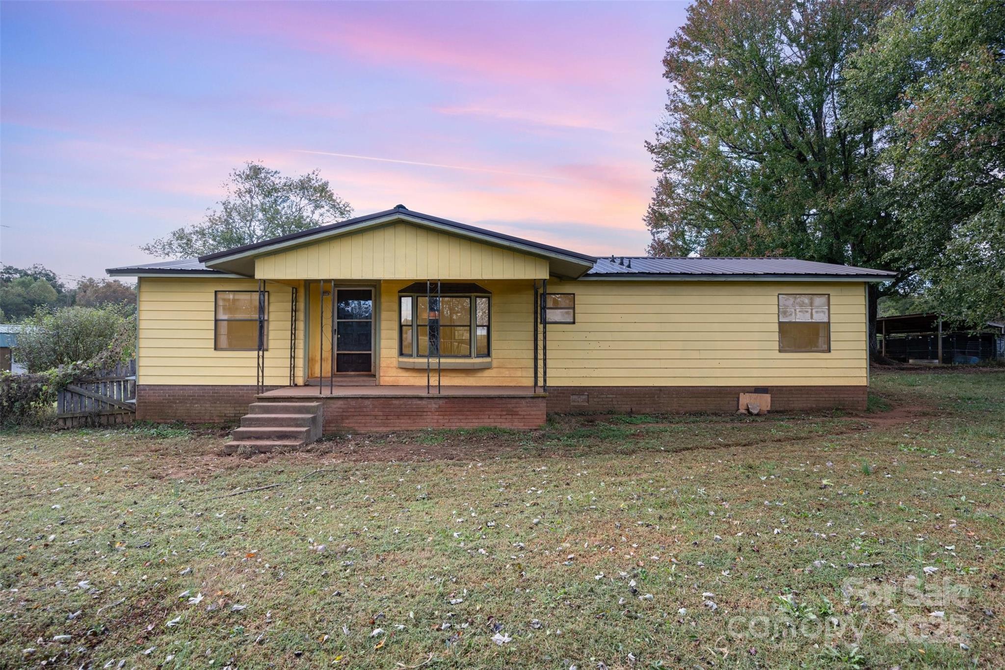 316 Josey Road Statesville, NC 28625 - Photo 2 of 27 a front view of a house with a garden
