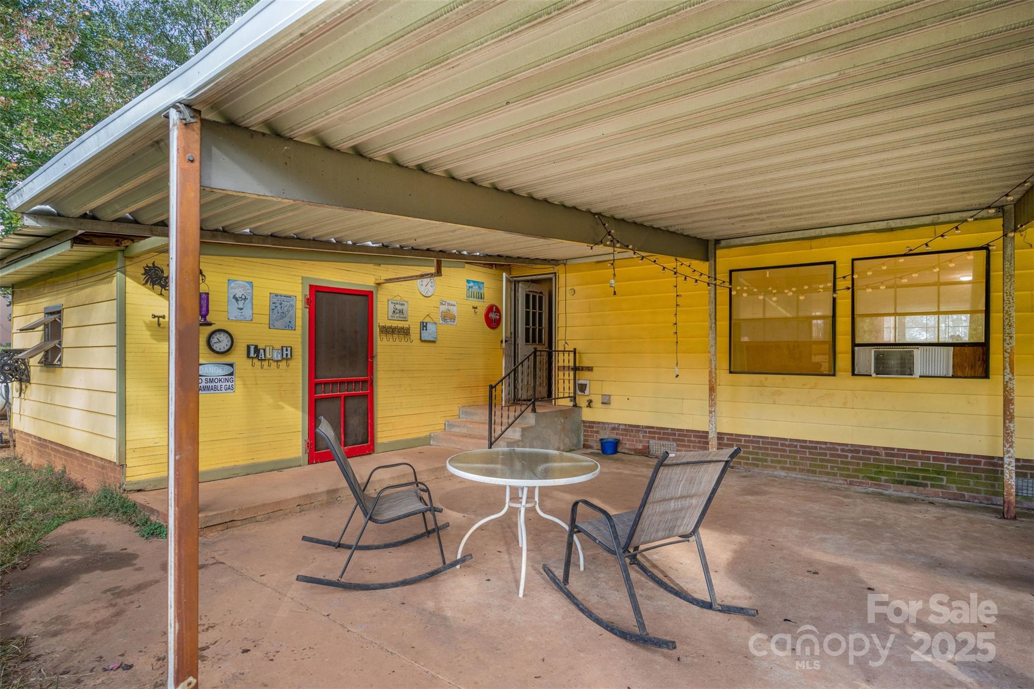 316 Josey Road Statesville, NC 28625 - Photo 21 of 27 a outdoor space with the couches and dining table under an umbrella