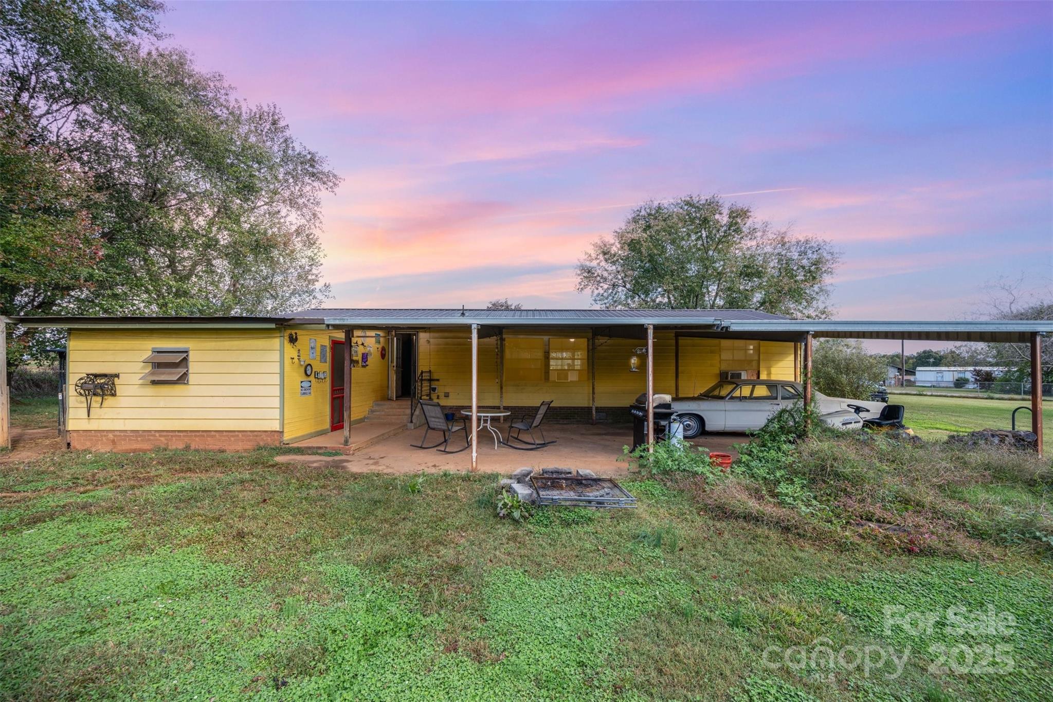 316 Josey Road Statesville, NC 28625 - Photo 22 of 27 a backyard of a house with table and chairs
