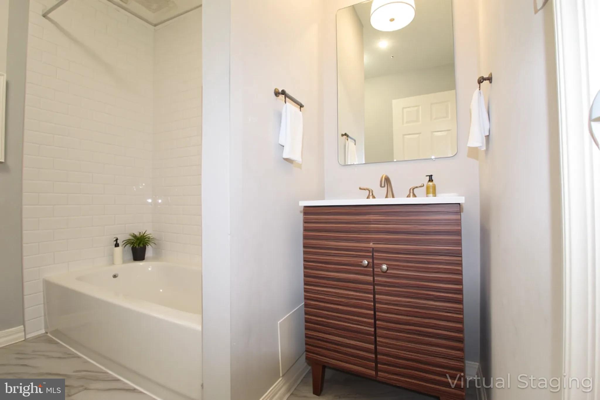 421 Bridgeboro Street Riverside, NJ 08075 - Photo 12 of 19 a bathroom with a sink and a mirror