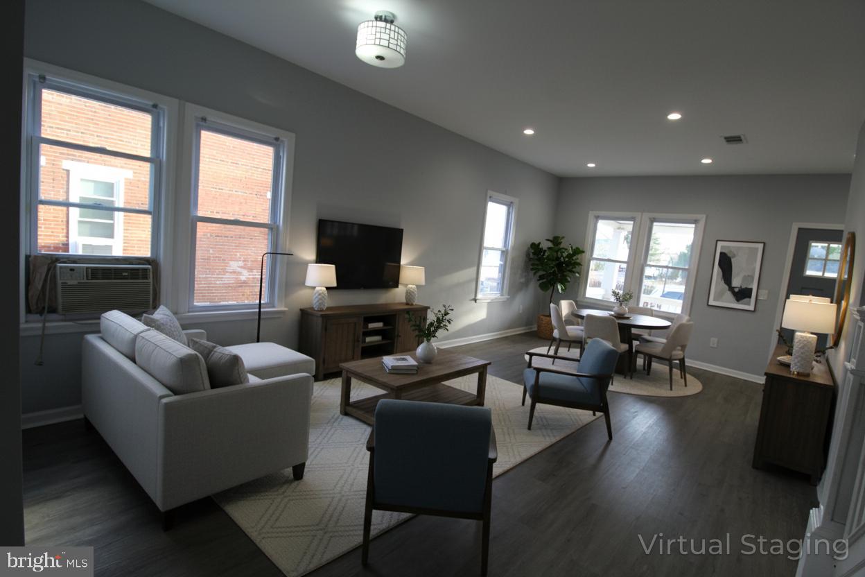 421 Bridgeboro Street Riverside, NJ 08075 - Photo 2 of 19 a living room with furniture wooden floor and a flat screen tv