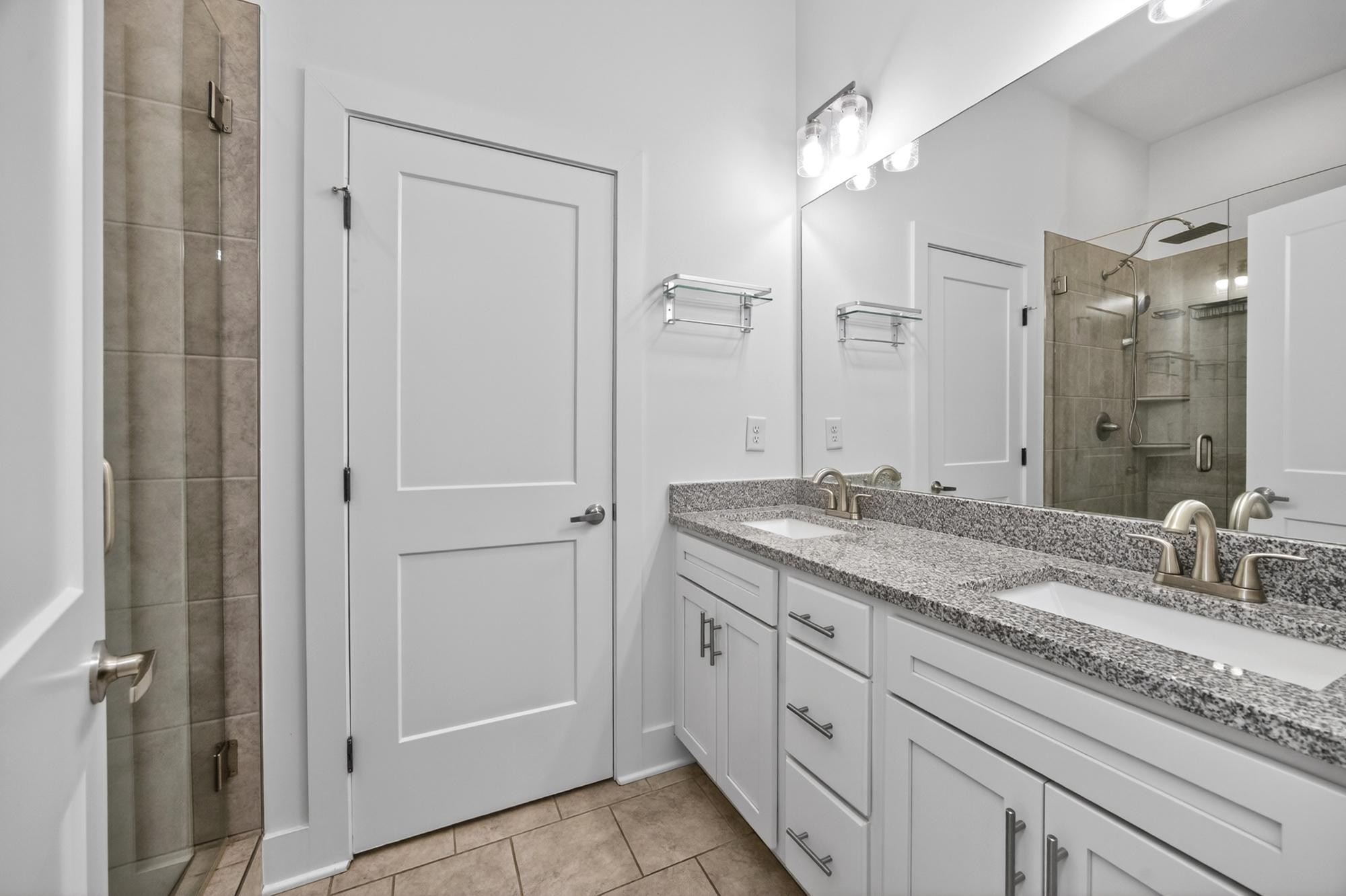 7 Decatur Street Nashville, TN 37210 - Photo 24 of 43 a bathroom with a granite countertop sink and a mirror