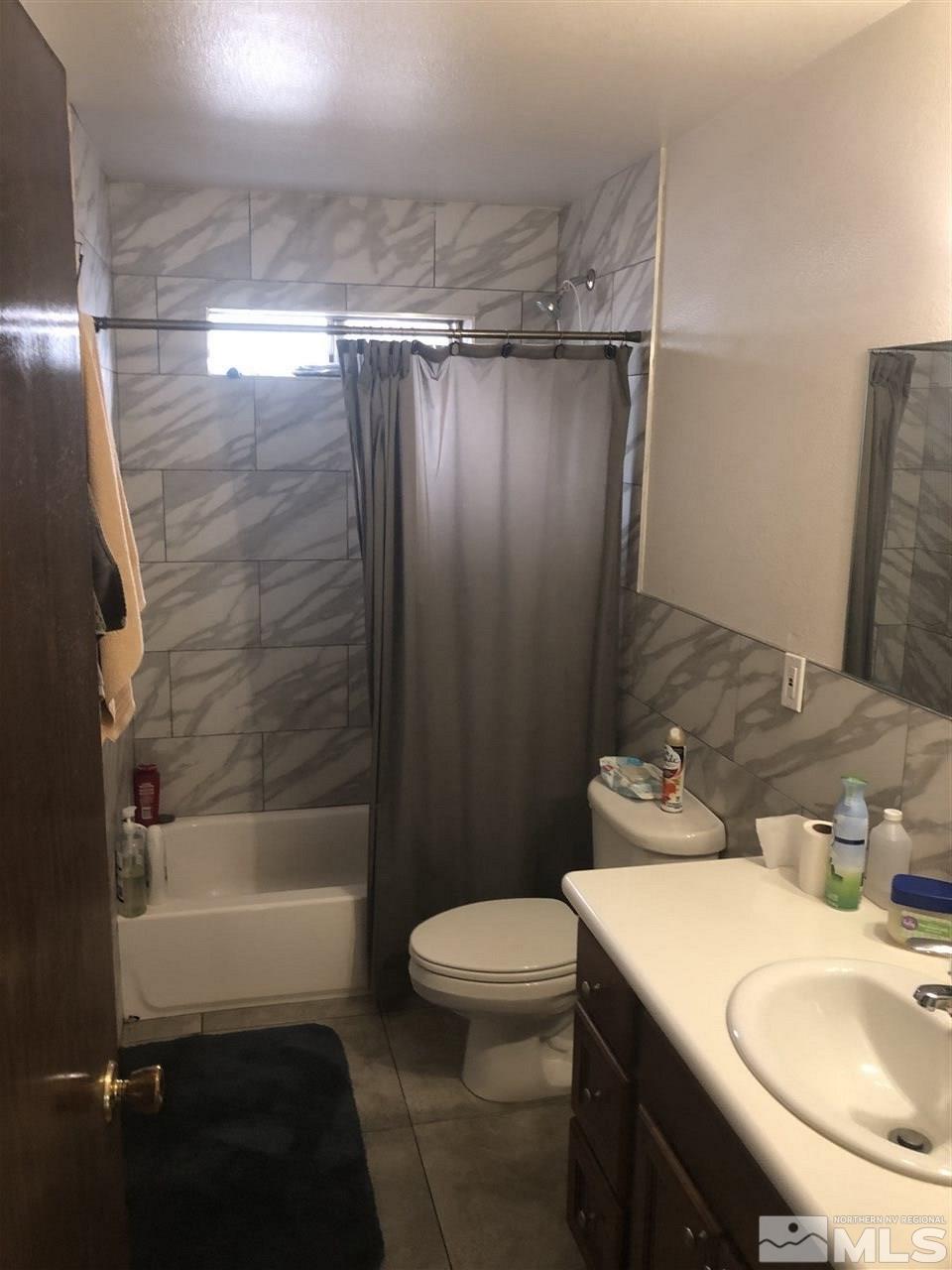 1364 Riley Avenue Reno, NV 89502 - Photo 3 of 5 a bathroom with a sink toilet and shower