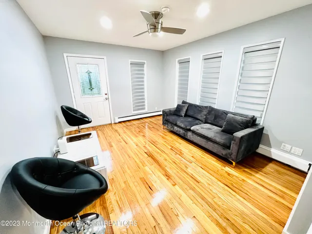 a living room with furniture and a rug
