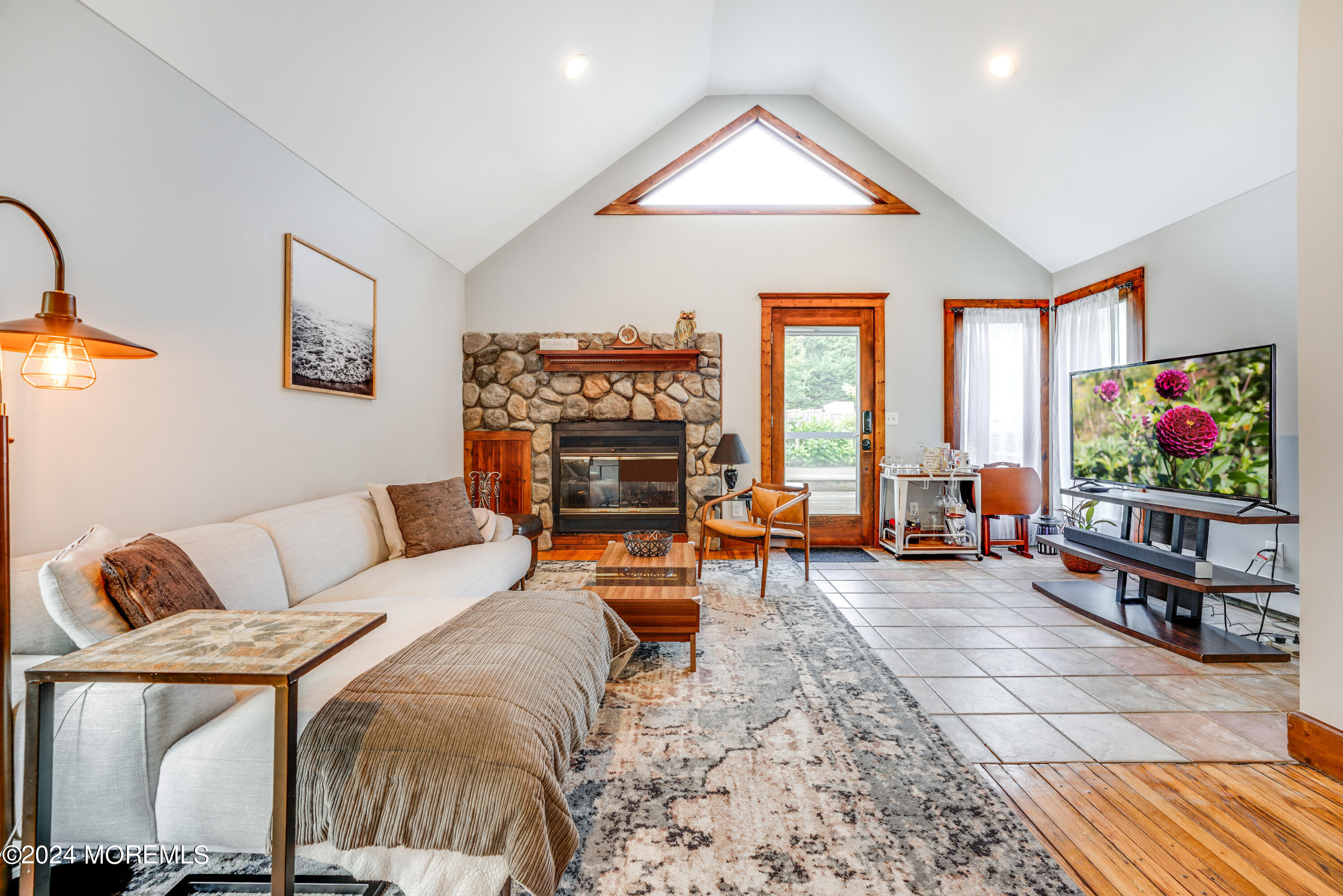500 Locust Point Road Rumson, NJ 07760 - Photo 1 of 48 a living room with furniture and a flat screen tv