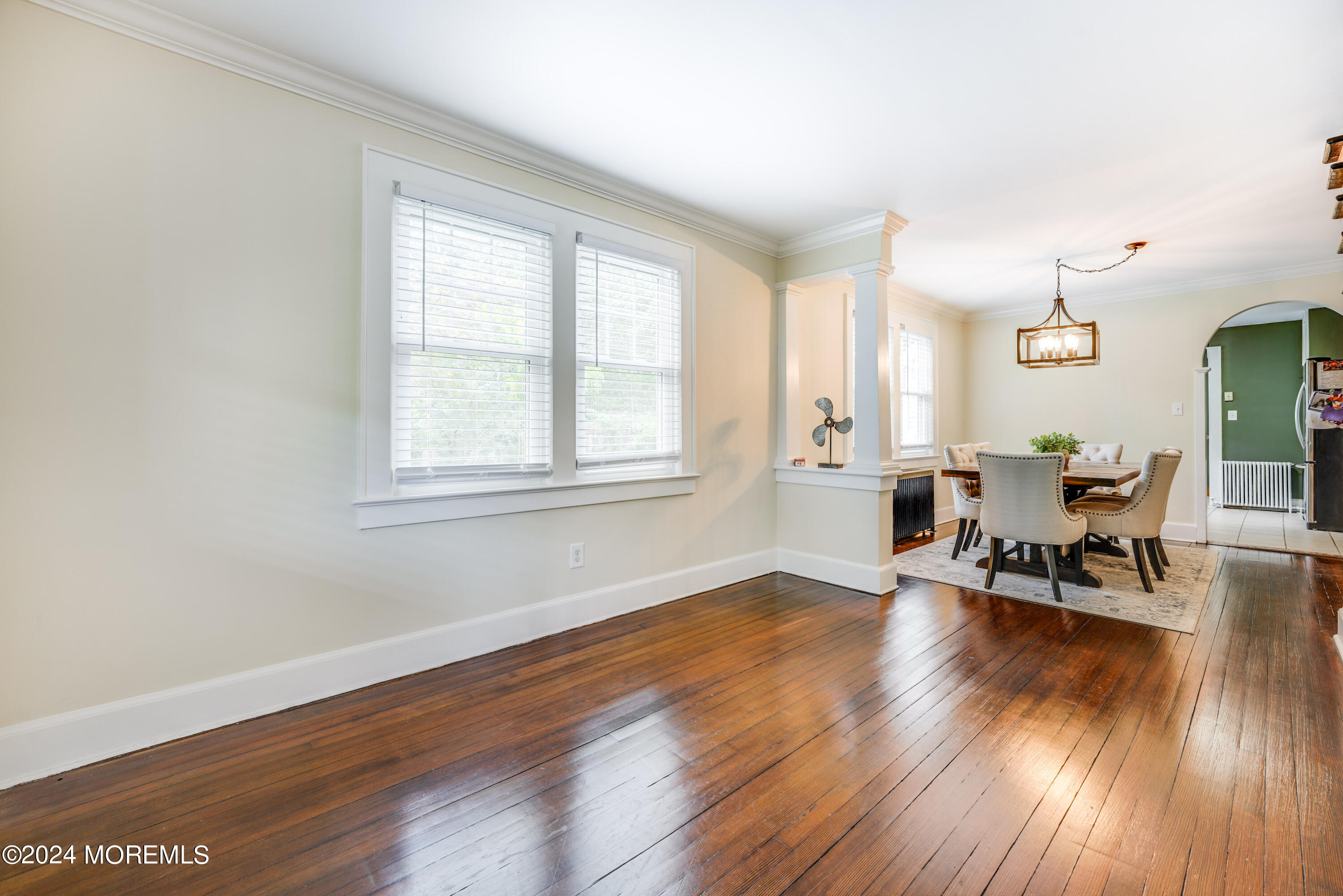 500 Locust Point Road Rumson, NJ 07760 - Photo 11 of 48 an empty room with wooden floor and windows